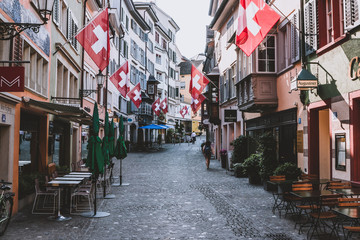 Walk through old buildings in historic center of Zurich city