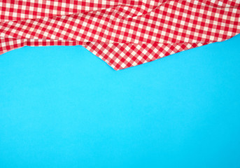 white red checkered kitchen towel on a blue background, bright picnic background