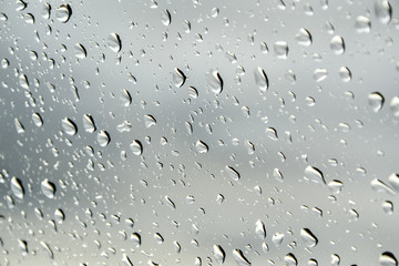Raindrops on a window - autumn weather forecast