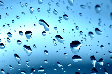 Raindrops on a window - autumn weather forecast