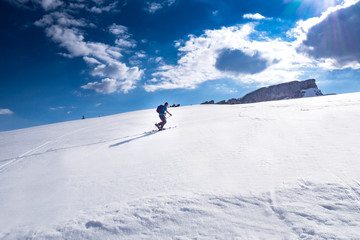 Ski tourer in the alps ascending