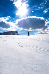 Ski tourer in the alps ascending