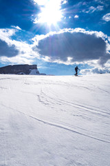 Fototapeta na wymiar Ski tourer in the alps ascending