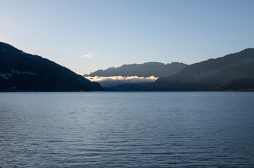 Panorama of Thun lake and away mountains in city Spiez, Switzerland