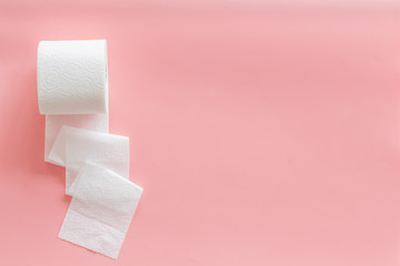 Toilet paper for proctology diseases concept on pink background top view mockup