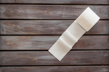 Toilet paper for proctology diseases concept on wooden background top view mock-up