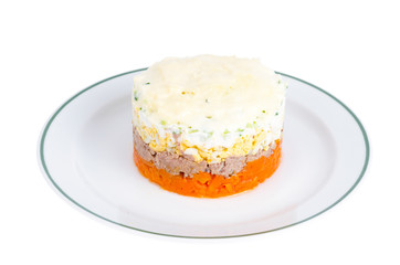 Obraz na płótnie Canvas Portion layered salad with fish, carrots and eggs. 