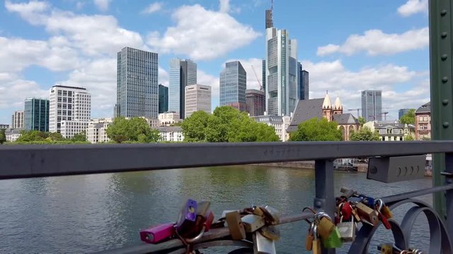 View of colorful locks of love on the Eiserner Steg (Iron Bridge) over the Main river in Frankfurt, July 2019