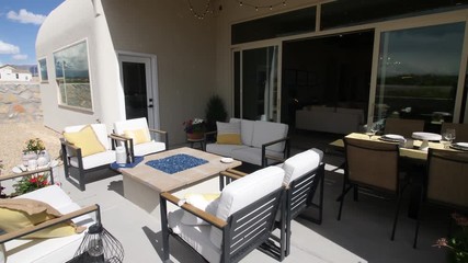 Backyard Patio Lower with Glass Fire Pit. view moves down on a furnished patio setting with glass fire pit