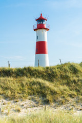 Lighthouse red white on dune. Sylt island – North Germany.  