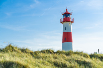 Lighthouse red white on dune. Sylt island – North Germany.  