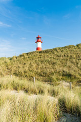 Lighthouse red white on dune. Sylt island – North Germany.  
