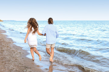 Happy young couple at sea resort