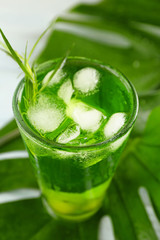 Glass of tasty summer cocktail on table