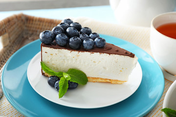 Tasty cake with blueberry on plate