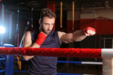Sporty man in boxing ring