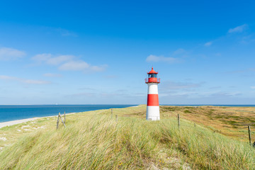 Lighthouse red white on dune. Sylt island – North Germany.   © ryszard filipowicz