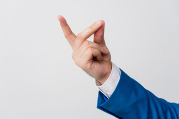 Isolated hand pointing with finger into copy space. Business concept with pointing finger.