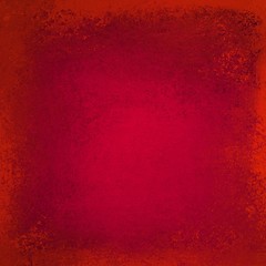 Fototapeta premium Textured red background with lots of distressed old vintage grunge texture and rich Christmas color