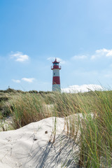 Lighthouse red white on dune. Sylt island – North Germany.  