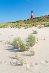 Lighthouse red white on dune. Sylt island – North Germany.  