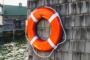 Lifesaver on the side of a wooden wall