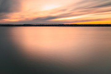 Sunset over calm water