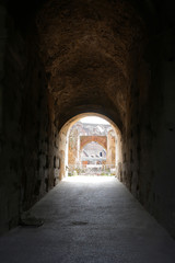 Fototapeta na wymiar Arched passage inside Roman Colloseum (Coliseum)