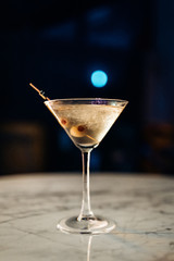 Fresh, cold alcoholic cocktail martini extra dry with olives