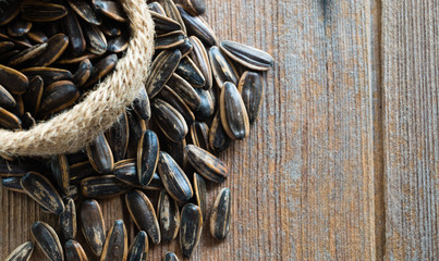 Sunflower seeds on wooden background