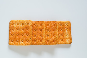 crackers with sugar on white background