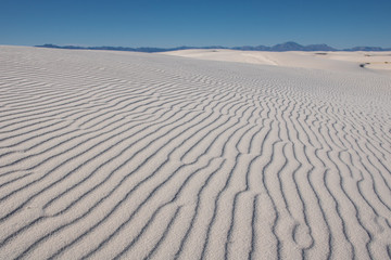 Fototapeta na wymiar Rippled white sand dunes
