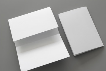 Blank portrait mock-up paper. brochure magazine isolated on gray, changeable background / white paper isolated on gray