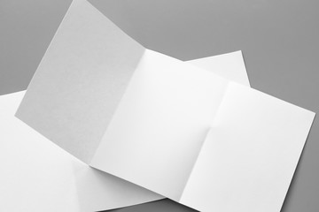 Blank portrait mock-up paper. brochure magazine isolated on gray, changeable background / white paper isolated on gray