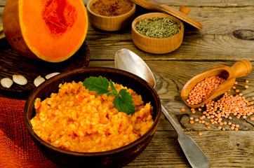 Vegetarian food, porridge with pumpkin and lentils.