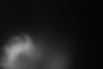 black paper texture or background with spotlight, dark wall backdrop wallpaper, dark tone.