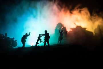 Naklejka na ściany i meble War Concept. Military silhouettes fighting scene on war fog sky background,
