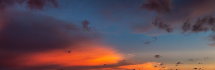 Dramatic Panoramic View of a cloudscape during a cloudy and colorful sunset. Taken over Beach Ancon in Trinidad, Cuba.