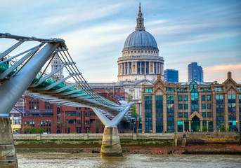 Fototapeta premium St. Paul's Cathedral across Millennium Bridge and the River Thames in London, UK.