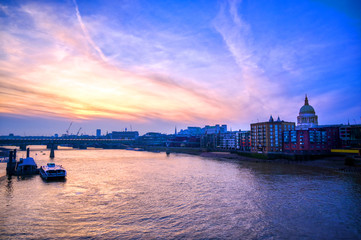 Naklejka premium St. Paul's Cathedral across Millennium Bridge and the River Thames in London, UK.