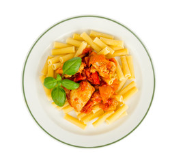 Pasta with pieces of chicken, tomatoes and sweet paprika.