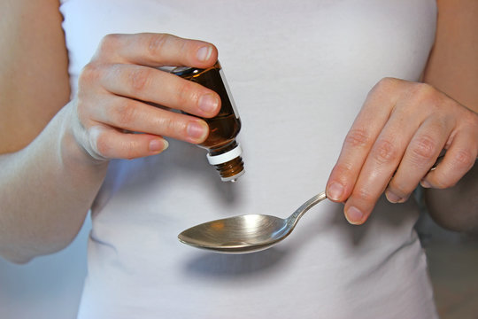 medetsina drops from pain in female hands, health care