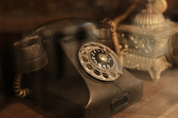 collectibles and decoration - Classic and old telephone reciever. retro technology. vintage color tone.