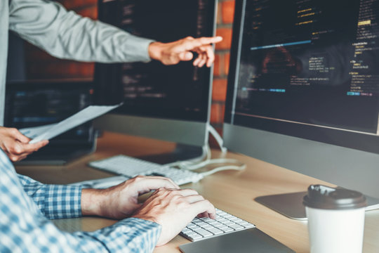 Developing programmer Team Development Website design and coding technologies working in software company office