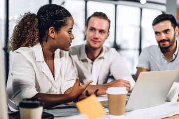 Successful group of casual business discussing and working with laptop computer.creative business people planning and brainstorm in modern office.Teamwork concept