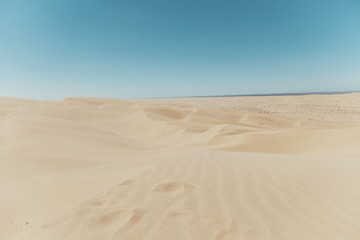 sand dunes with blue sky