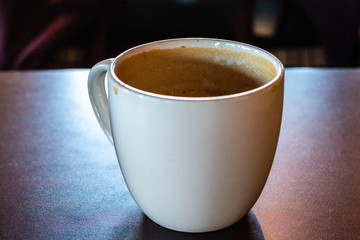 Empty coffee cup with foam around the rim