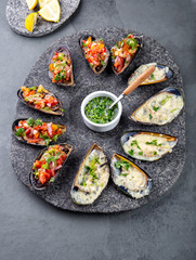 Seafood assorted platter Macha and mussels a la parmesana, mussels a la chalaca, clams with herb sauce