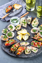 Seafood assorted platter Macha and mussels a la parmesana, mussels a la chalaca, clams with herb sauce