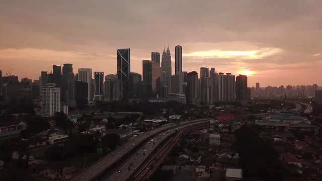 Kuala Lumpur, Malaysia - 1 July 2019: Aerial view of Kuala Lumpur city in Malaysia capital, tall buildings. Cinematic video of skyscrapers in big City.